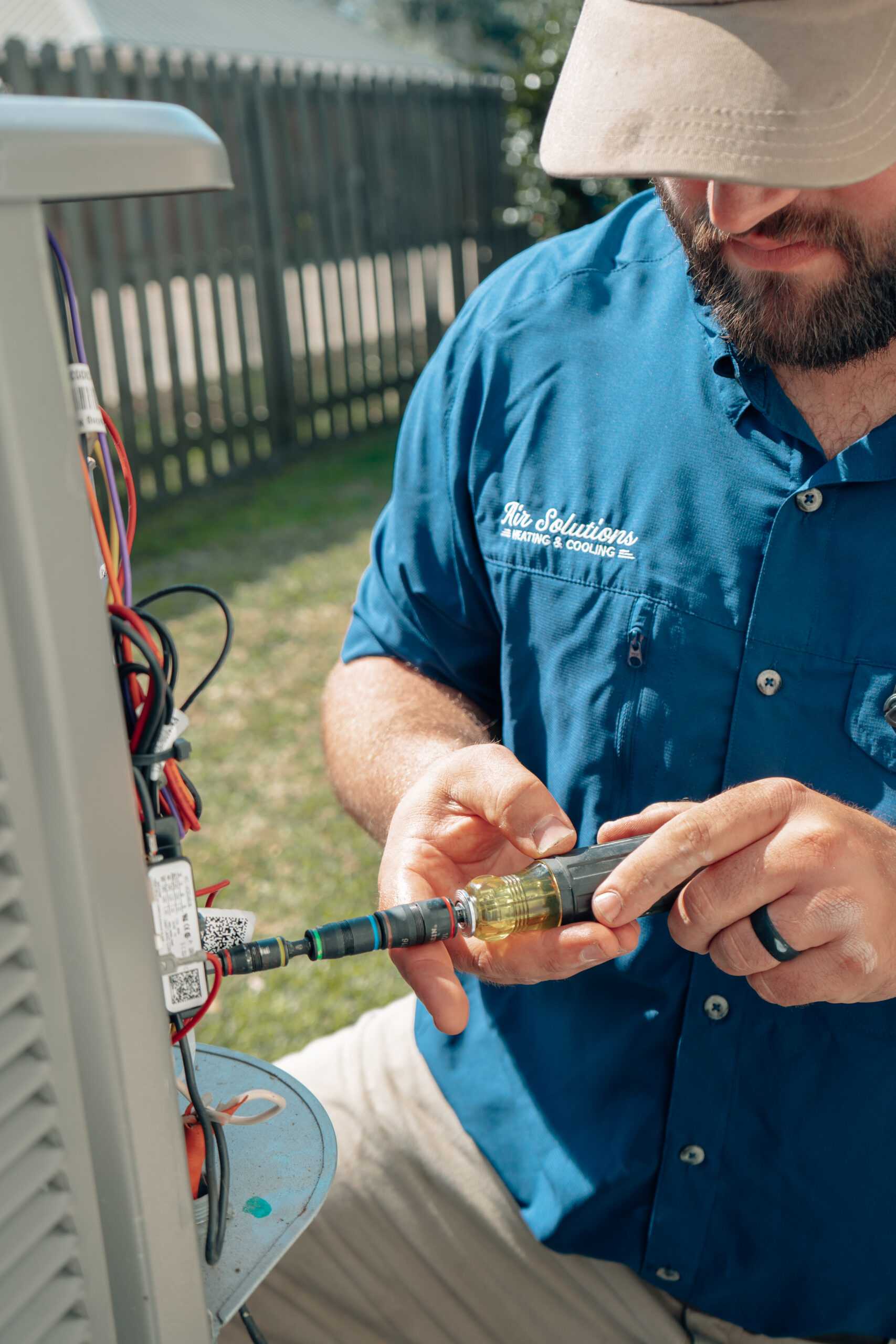 AC Maintenance performed by Air Solutions Heating and Cooling AC Repair Technician